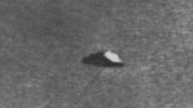 This is one of the three photographs taken near Namur, Belgium on June 5, 1955. The one who took the photo claimed that at 7:30 P.M. that day, he spotted a sharp gleam moving high in the horizon at a very high speed. This, he said, was accompanied by a disc-like object that left a trail behind it as it moved.