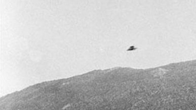 Riverside, California -Taken by Guy B. Marquand on November 23, 1951, this photo shows an alleged UFO on a mountain road near Riverside, California. According to its photographer, the UFO looked like a huge flying saucer trapped above the skyline.