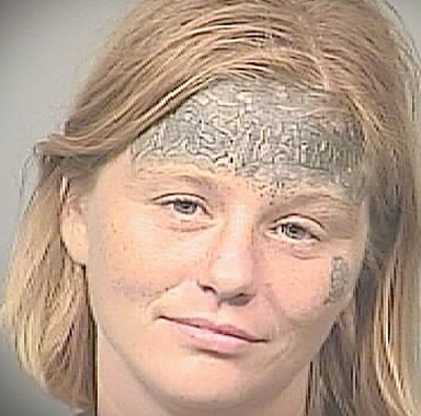 mugshot girl face tattoo