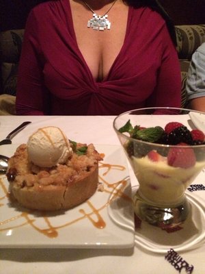 Enjoying fresh berries with cream and a personal deep dish apple crisp with Haagen Dazs vanilla ice cream and a caramel drizzle