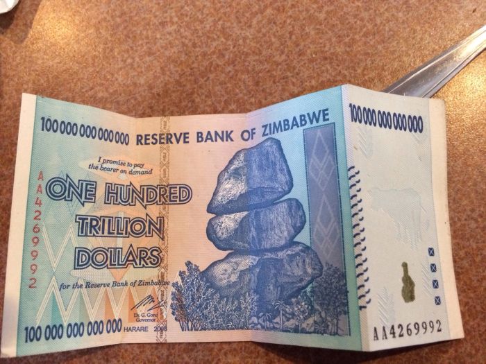 Fascinating photos - 100 trillion dollar note - 10000000000000 100000000000000 Rese 00000 Reserve Bank Of Zin Nk Of Zimbabwe I promise to pay the bearer on demand Noon One Hundred Trillion Dollars for the Reserve Bank of Zimbabitne 1,50 100 000 000 000 00