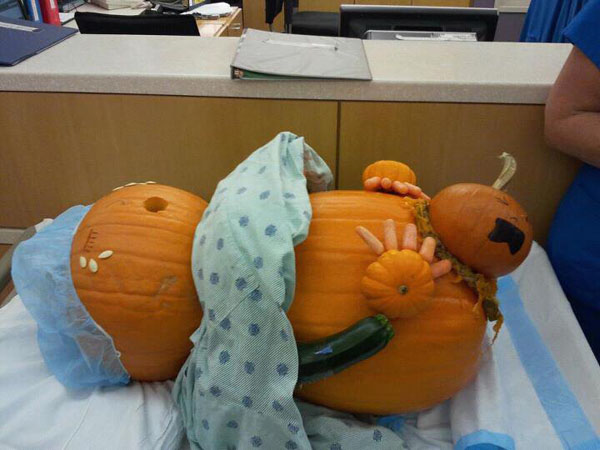 Creative Jack o Lantern carved pumpkin - pumpkin giving birth