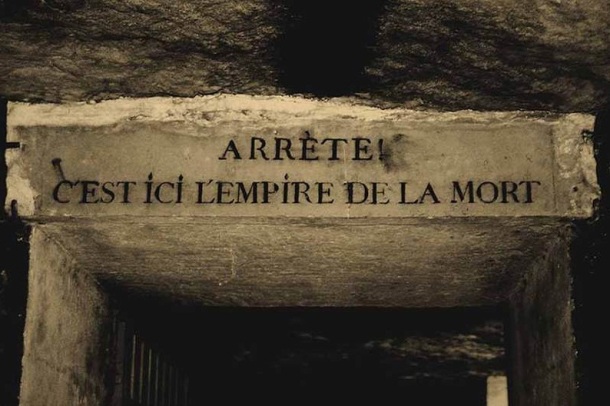 To get to the catacombs, visitors are advised to take the metro and get off at the Denfert Rocherea station. At the entrance to the catacombs, there is a gate with a sign saying Arrte! C'est ici l'empire de la Mort which means "Stop! Here lies the Empire of Death".