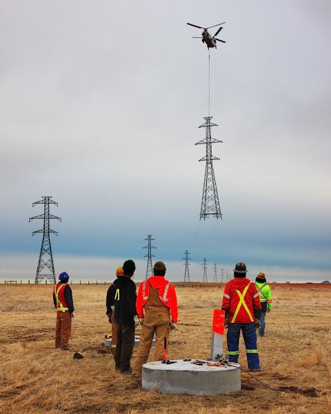 Installing a power line tower.