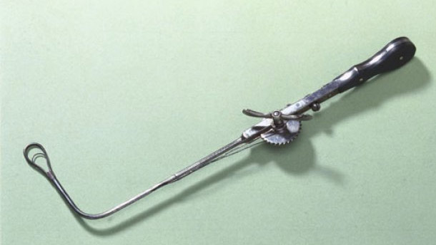 Ecraseur: The Ecraseur (French for "crusher") was a device used for the removal of hemorrhoids, tumors, polyps, and cysts in the esophagus, larynx, uterus, or ovaries. The loop on the end of the instrument housed either a saw-toothed chain or a simple wire and was used to strangle and crush whatever flesh it looped around.