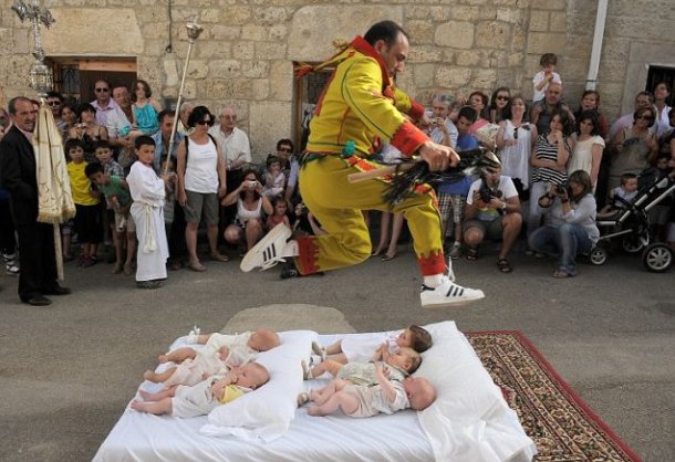 Baby jumping-Held every year in a small Spanish village Castrillo de Murcia, baby jumping seems to be one of the most deviant sport events of the list. During the act, known as El Salto del Colacho the devils jump, men dressed as the devil jump over newborn babies lined up on mattresses in the middle of the street. The origins of the tradition are unknown but it is said to cleanse the babies of original sin.