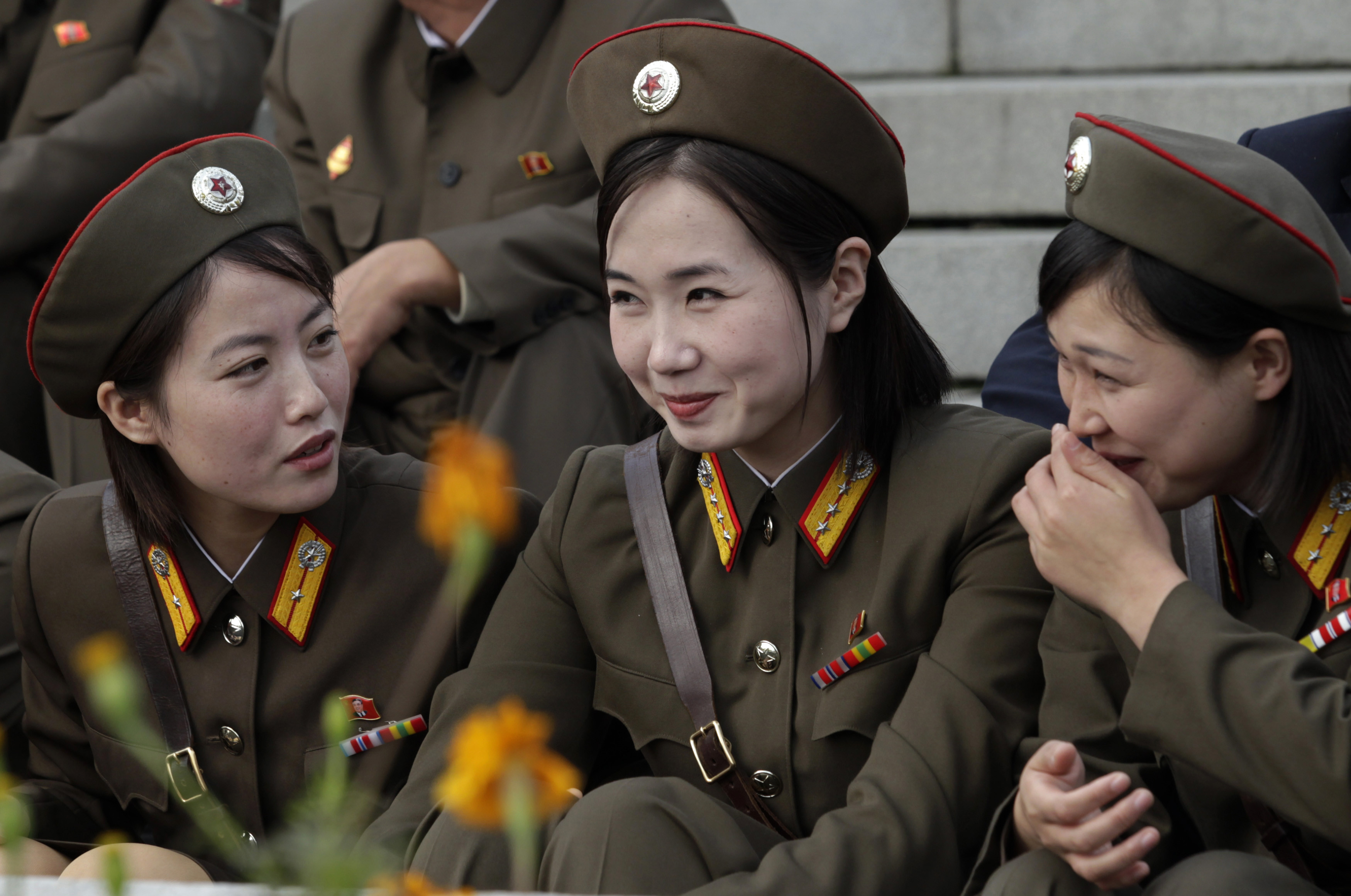 North Korean soldiers share a laugh.