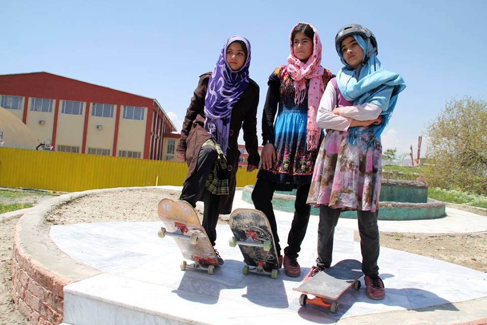 Young Afghani girls skateboarding.