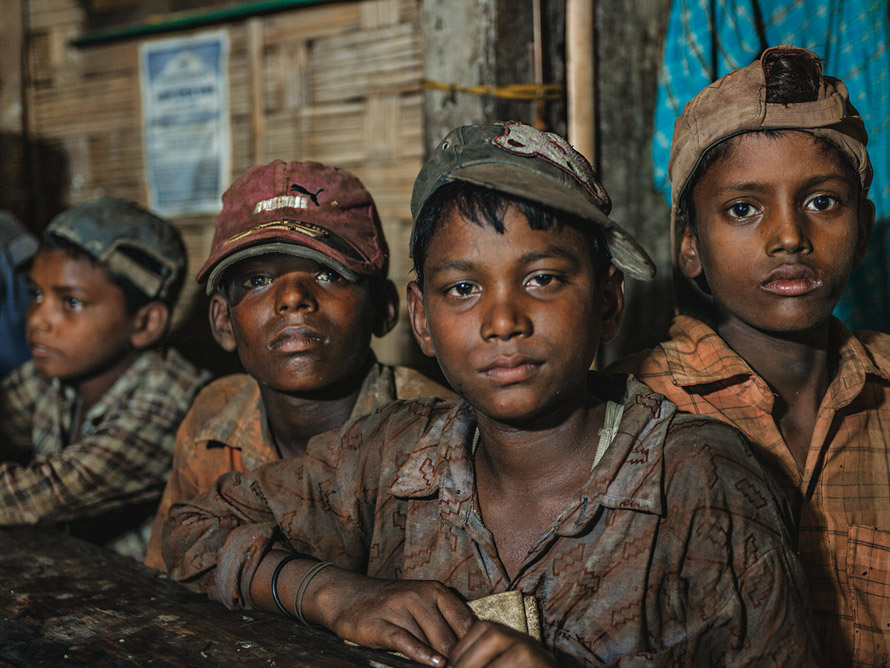 Young Bangladeshi ship-breakers claiming to be the minimum working age of 14, who make a dangerous living from dismantling old cargo carriers and tankers.
