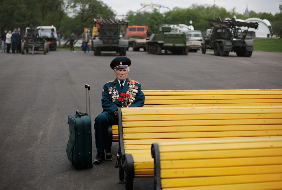World War II veteran from Belarus Konstantin Pronin, 86, sits on a bench as he waits for his comrades at Gorky park during Victory Day in Moscow, Russia, on Monday, May 9, 2011. Konstantin comes to this place every year after WWII finished. This year he was the only person from the unit.