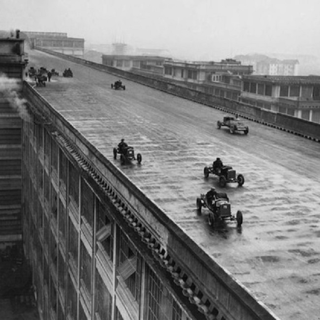 Factory workers race on the roof test track of the Fiat Factory in Turin, Italy, 1923.