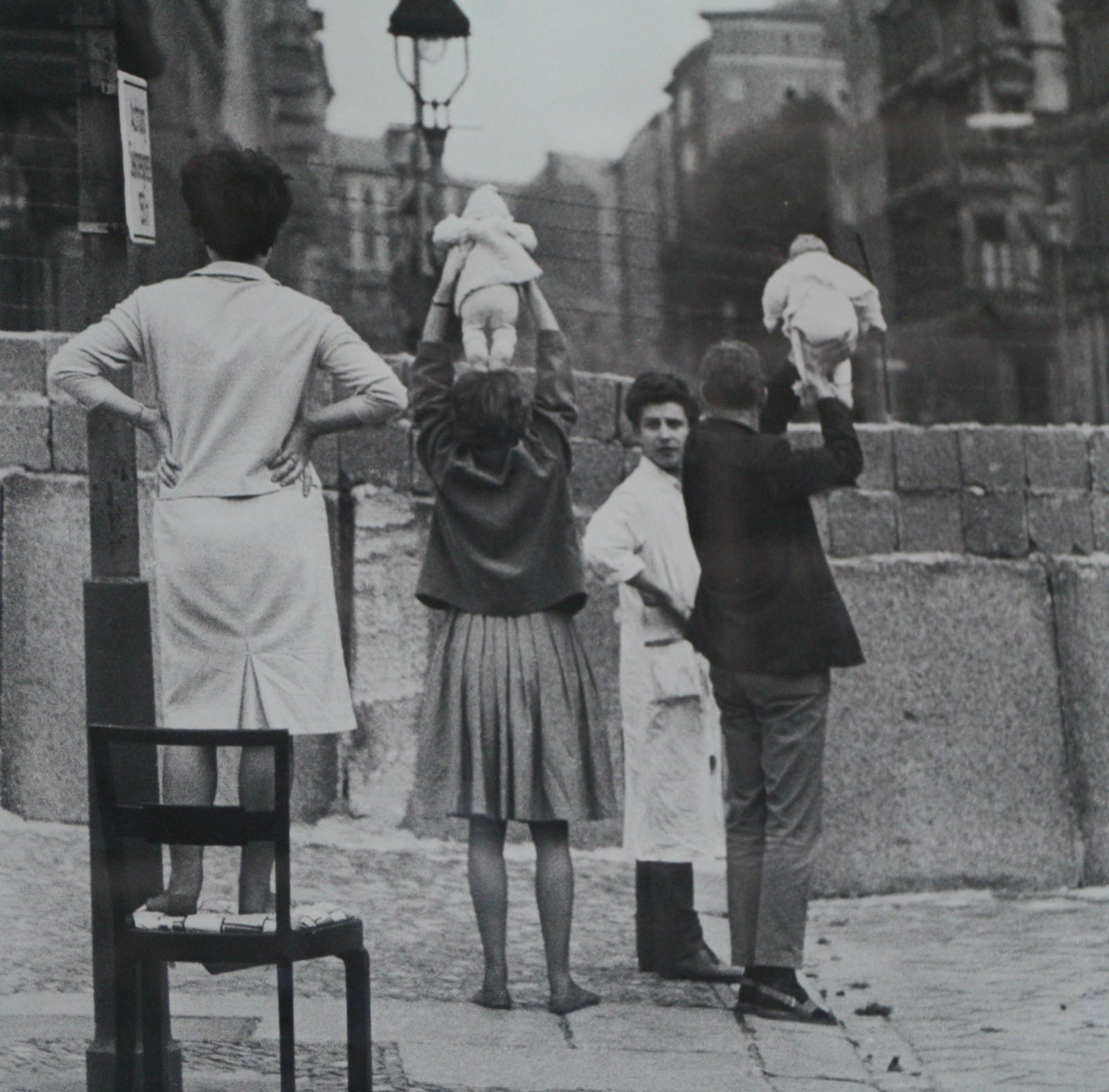 Residents of West Berlin show children to their grandparents who reside on the Eastern side, 1961.