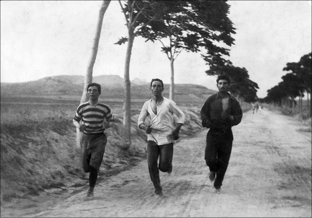 Three men running in the first marathon at the 1896 Summer Olympics.