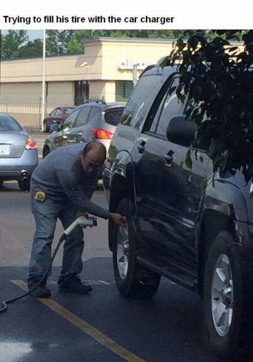 wrong Facepalm - Trying to fill his tire with the car charger