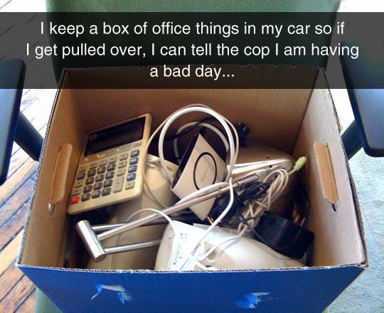box of things - I keep a box of office things in my car so if I get pulled over, I can tell the cop I am having a bad day... Leb LOU00