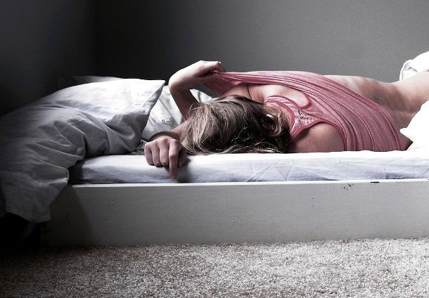 If that gut wrenching dizziness persist even after you throw yourself on your bed, put one of your legs on the ground. It will make your body feel more stable and reduces that unpleasant dizzy feeling.