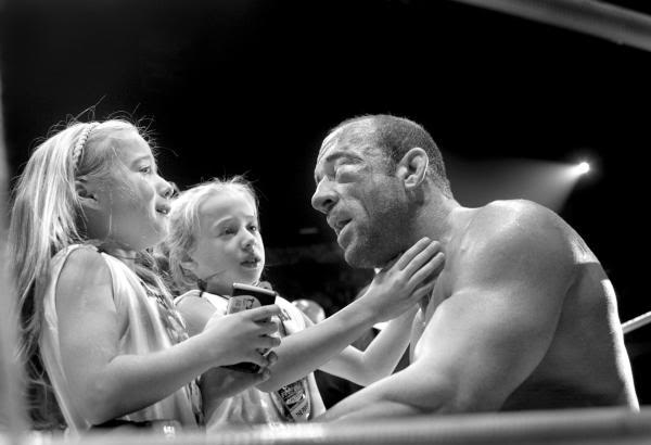 Poweful picture of mark coleman and his daughters post fight