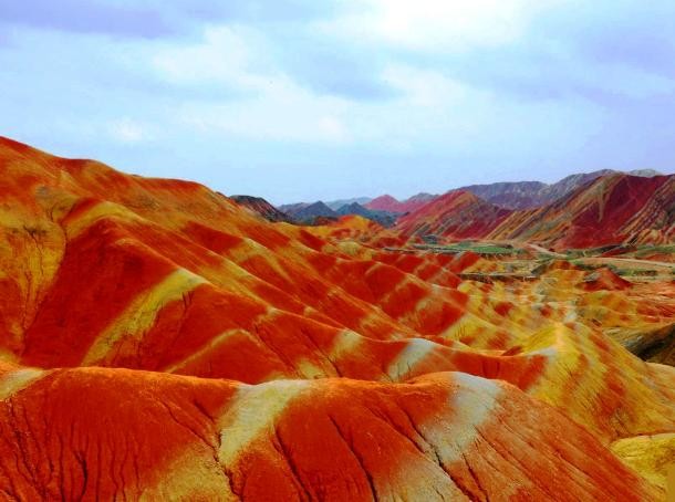 Found in several areas in southeast, southwest and northwest China, the Danxia landforms are a unique geomorphologic type of landscape characterized by a striking, mainly red coloration. Masses of cretaceous sandstone and limestone have been eroded by wind, sun and rain for millions of years, creating spectacular rock formations including pillars, ravines, columns, canyons etc.