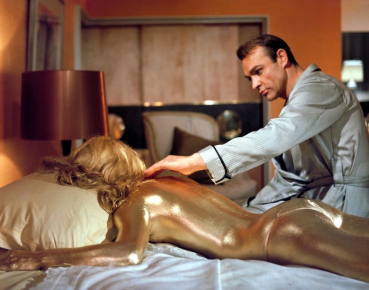 The Goldfinger death-Goldfinger is often hailed as one of the best Bond movies ever. It has all the hallmarks we look for in a Bond flick: a menacing villain aided by a terrifying henchman with an insane plot to rule the world, the introduction of the Aston Martin as a Bond car, memorable quotes, gorgeous Bond girls and lots of action. One noteworthy scene has Bond’s love interest meet with an unfortunate fate at the hands of Goldfinger. As a message to the secret agent, her body is left naked, covered completely in gold paint.

This memorable scene quickly spawned an urban legend that the actress in the movie died as result of the stunt. Because her entire body was painted, or so the logic went, her skin couldn’t breathe and she suffocated. There’s just one problem with that theory. The actress in question, Shirley Eaton, is still alive and well today. However, she did disappear from the limelight. A few years after the movie came out, Shirley retired from acting and focused on her family.