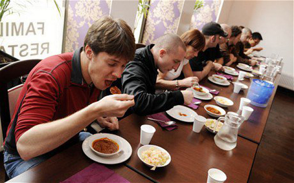 Hottest Chili Contest Backfires...An American named Curie (pronounced curry) Kim lived up to his name by entering a chili pepper eating contest at a curry house in Scotland. The peppers were no ordinary spicy peppers, however, but the dreaded Kismot Killer, one of the hottest in the world. Curie had to be taken to the hospital twice during the contest, and half of the 20 contestants ended up dropping out after witnessing the first 10 collapse and vomit. The owner promised to tone it down for next time.