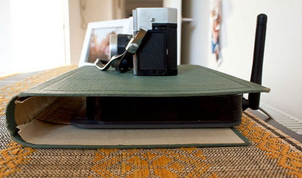 If that ugly router clashes with your decor and you have no idea what to do about it, try hiding it between the covers of a classic book. No one will know it's there.