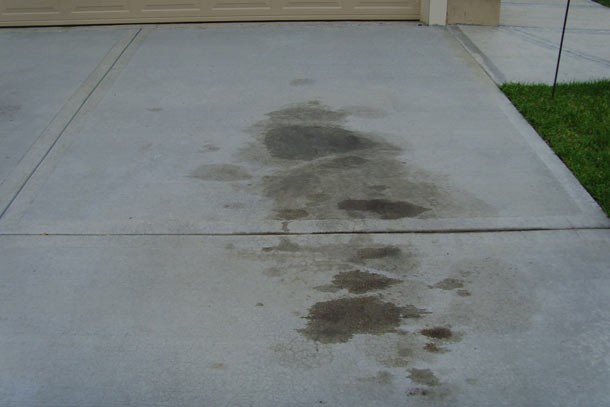 Clean oil stain from garage floor. Let the stain soak in Coke, then hose off