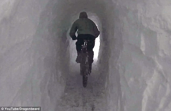 Tunnels you can ride a bike through all over North America...Look, tunnels everywhere! Pictures of snow tunnels have been popping up all over the internet as people from Canada to Massachusetts have run out of places to put all that snow, so they just tunnel through it instead