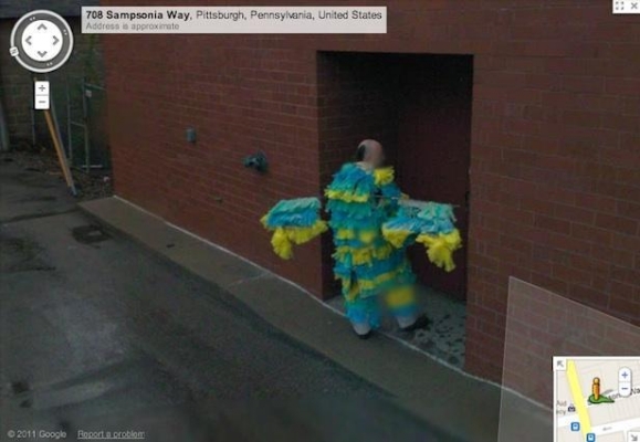 He's so ashamed of his costume, he's trying to hide down an alley - thank goodness for Google Street View!