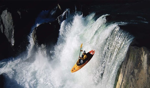 kayak going over waterfall