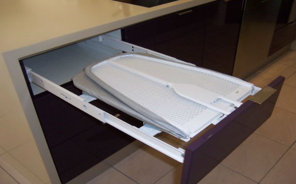Install a foldout ironing board. Trust us; it will make your life so much easier.