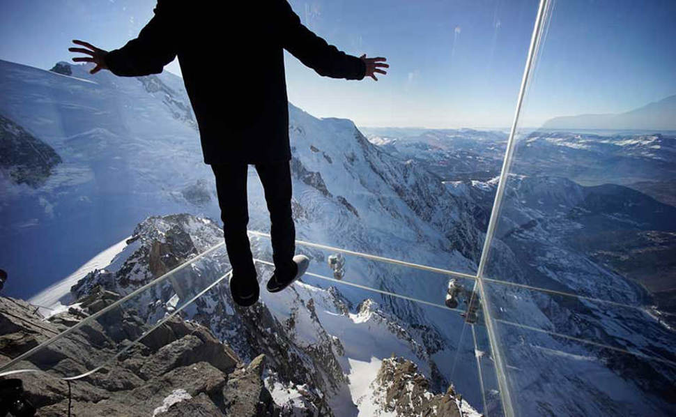 Atop the 12,600 foot Aiguille du Midi peak is a glass cage named “Step into the Void.” Visitors enjoy the view of Mont Blanc, Europe’s highest mountain, from what is the world’s highest glass floor.