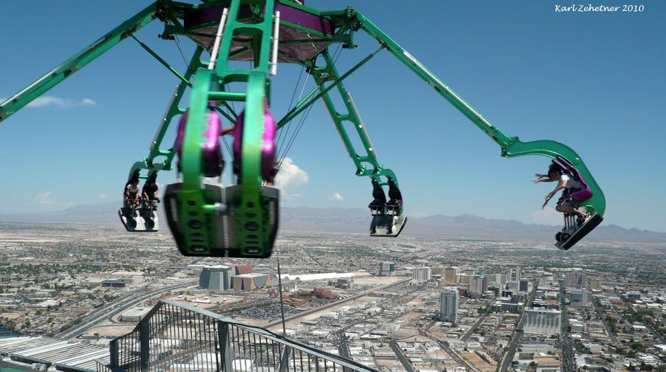 Insanity at the Stratosphere Hotel in Las Vegas, USA...Insanity is a ride that spins you at speeds of up to three G's. It also hangs 64 feet from the side of the Stratosphere Hotel and 900 feet above the ground. Yikes.