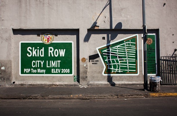 Skid row...Now referring to the poor part of a city, skid row was originally attributed to the area in Seattle, Washington, where unemployed loggers would hang out. It was generally the road next to the skids (the planks used to rolls logs) where they would wait in hopes of finding work.