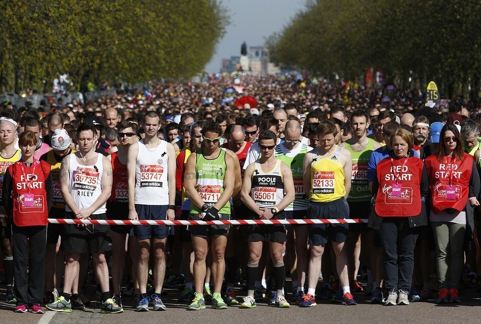 Thousands of runners observe a moment of silence for the victims of the Boston Marathon bombings before the start of the London Marathon in Greenwich, southeast London