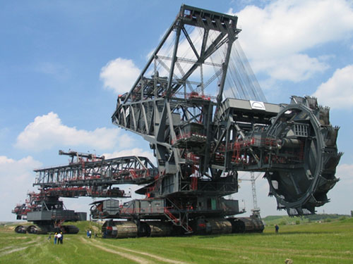 Bagger 293...No, it’s not Devastator, but it sure looks like a Decepticon in hiding. The Bagger 293 is a terrifying mining excavator that can carve out a hole the size of a football field measuring about 270 ft deep ... all in one day. It requires over 16.5 megawatts of power just to operate it (roughly the same amount of power 2500 houses consume per day). Compared to this, you are nothing.