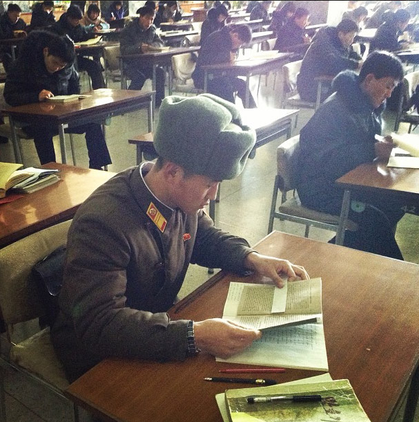 North Korean soldier reading at the Grand People’s Study House.