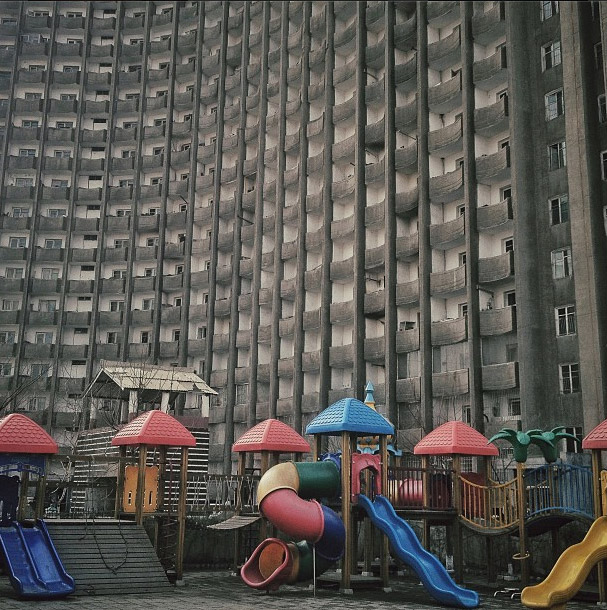 Playground in front of a building.