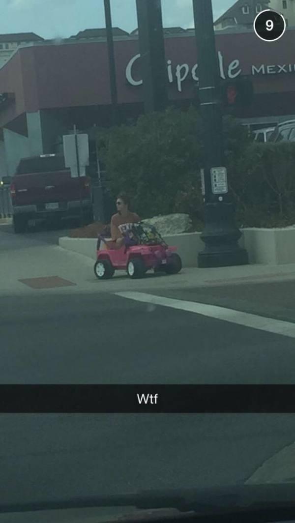 A college student rides around campus in a Barbie Jeep after her license is suspended