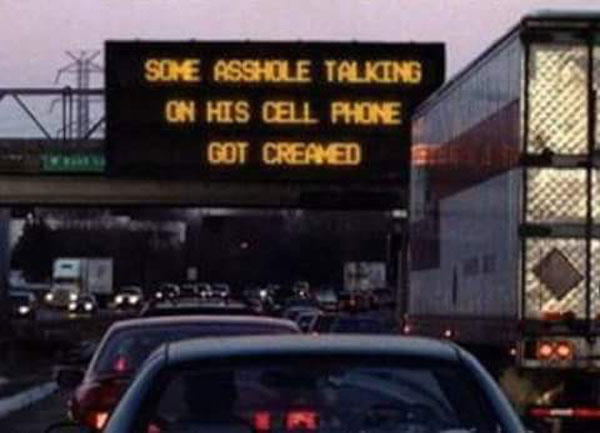 funny highway signs - Some Asshole Talking On His Cell Phone Got Creamed
