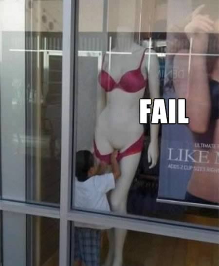 little boy pulling down a mannequins underwear