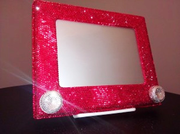 Crystals-studded Etch-a-Sketch, price: $1,500...Do you remember playing with an Etch-a-Sketch? When introduced back in 1960, these mechanical drawing toys were sold for $3 each. In 2003, FAO Schwarz came up with a special limited edition Etch-a-Sketch, studded with 14,400 hand-set red Swarovski crystals. Twelve of these limited editions were made and each was sold for $1,500.