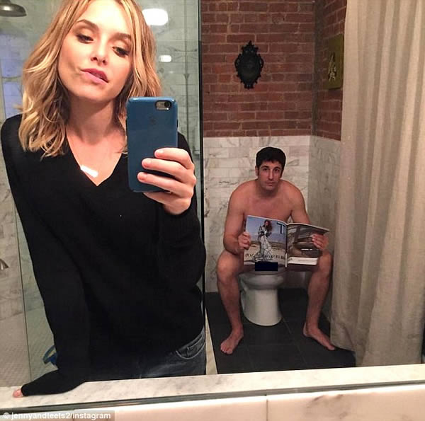Jason Biggs' wife tries to make a joke but ends up revealing more than she intended to on Instagram...Jenny Mollen decided to joke around with fans by posting a selfie that featured a naked Jason Biggs sitting on the toilet in the background. Although the funnyman, 37, was attempting to cover his modesty with a magazine, he accidentally ended up exposing himself. After realizing that she'd shown off more her husband than she meant to, the performer and writer deleted the risque photograph.