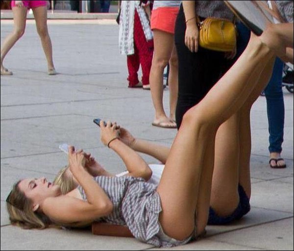 girls laying on the floor and texting