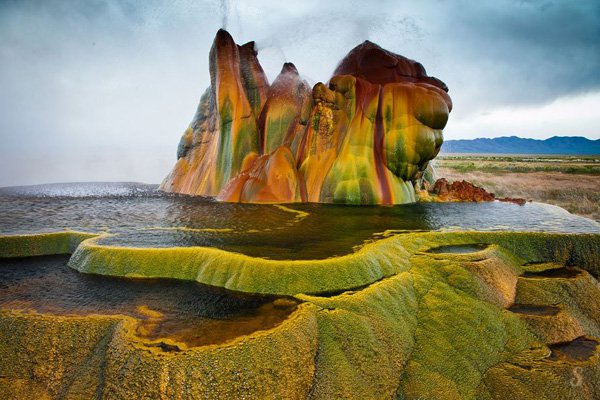 United States : The Fly Geyser Fly Geyser is a small geyser in Washoe County, Nevada, which gives the impression of a brown ooze greenish color...