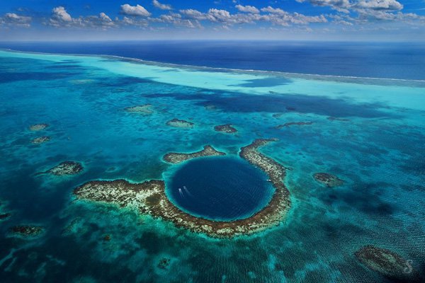 Belize : The Great Blue Hole The Great Blue Hole is an underwater cenote off the coast of Belize. It is almost circular with a diameter of 300m and 120m deep...