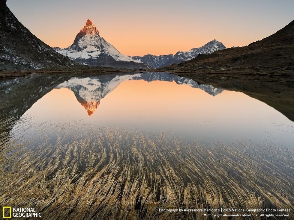The Matterhorn-Switzerland's Alpine Emblem...The photographer, Alessandra Meniconzi, says: "The famous Matterhorn (14,692-foot /4,478-meter) is an iconic emblem of Switzerland and The Alps, but also the most photographed mountain in the world. I want to add an element in the image that conveys the eye to the pyramid-shaped mountain. The best time to photograph the Matterhorn is during the sunrise when the top becomes red."