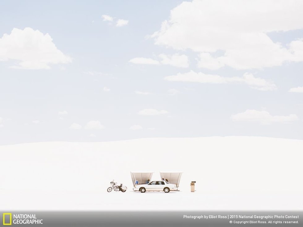 Shade, White Sands...The photographer, Elliot Ross, says: "On an afternoon cresting 100 degrees fahrenheit, I was making my way to the only shade visible. When I was about 20 yards away, this group pulled in and beat me to it. My frustration melted when I saw how perfectly symmetrical their vehicles made my frame."