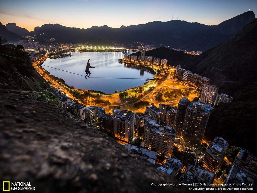 Highline at Twilight - Rio de Janeiro...The photographer, Bruno Moraes, says: "Marcio Cardoso balancing on the slackline 200m above the beautiful landscape of Rio de Janeiro."