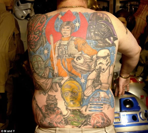 The Star Wars fan who has 14 tattoos of the film's iconic characters.An obsessive Star Wars fan has brought "a galaxy far, far away" much closer to home—by getting the cast of the legendary films tattooed all over his body. Dedicated Luke Kaye—Britain's number one amateur Jedi Knight—has covered his back, arms and legs with iconic figures from all the movies films.

Since getting his first tattoo of Jedi Master Yoda in 2005, Luke has added another 13 images of iconic characters to his collection. Luke, 42, has endured more than 100 painful hours in tattoo artists' chairs in hometown Swindon, Wilts.Still needs Chewbacca