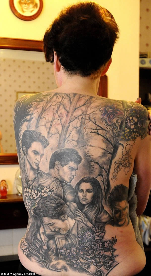 The woman who got a Twilight back piece to celebrate her 70 pound weight loss.After 49-year-old Cathy Ward lost 70 pounds and dropped 14 dress sizes in six months, she decided to get a permanent reminder of her inspiration—the Twilight series of books and movies. Ward spent 22 hours and $3000 to put her favorite characters on her back. However, the supermarket worker from Reading, England isn't done quite yet— she plans to save another $3,500 to cover her whole torso with the gothic tribute